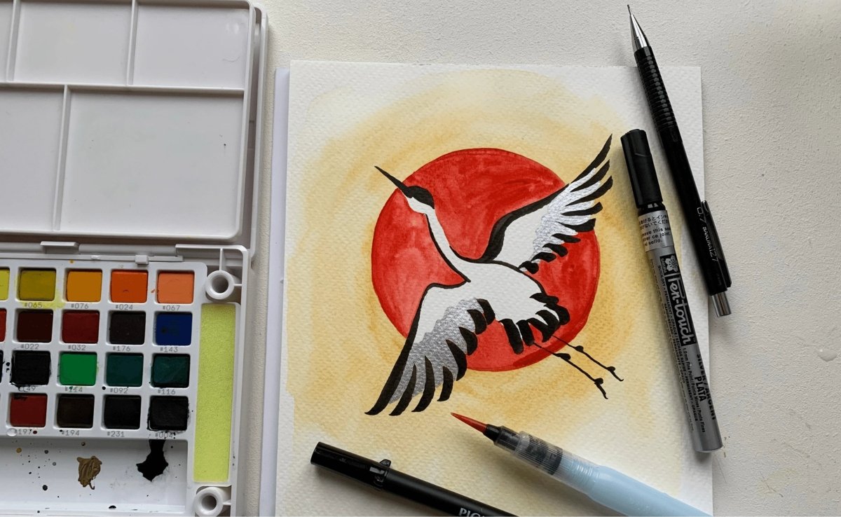 Painting a crane and red sun in watercolour - Royal Talens