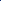Three tubes of blue acrylic paint and a small round container of gray pigment arranged on top of a blue paint smear against a solid dark blue background.